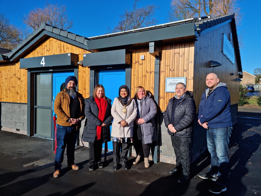 Group photo of councillors outside the new changing rooms at Britannia Park