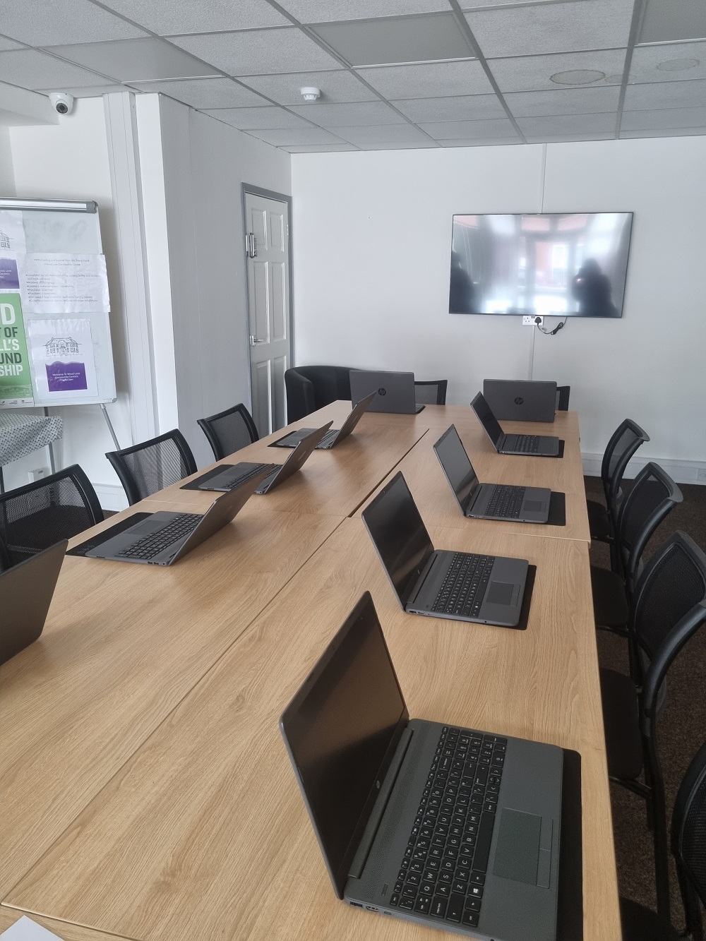 Picture of table and laptops at the digital den