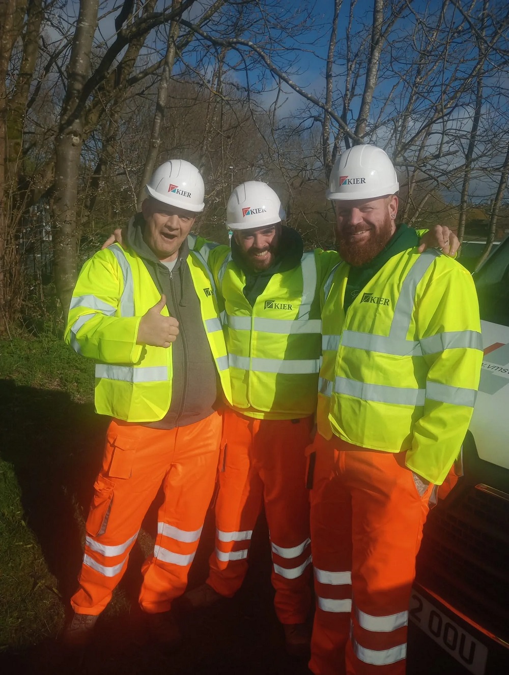 Three Kier employees in hivis and hard hats